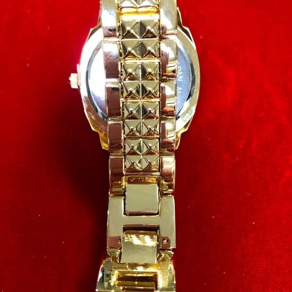 NEW WITH TAGS!! Wildlife gold-tone ladies wristwatch by Heidi Klum